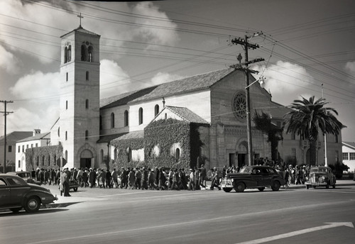 Mexican workers walking away from church