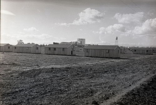 Labor camp buildings at Spreckels Sugar Company, Woodland California with fields in foreground