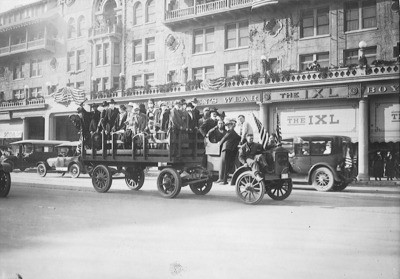 European War, 1914-1918 - Stockton: Victory Parade of soldiers and citizens during ""flu"" epidemic at the end of World War I, The IXL, Stockton Hotel, Weber St