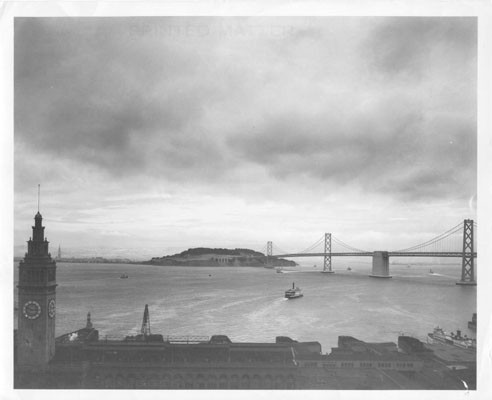 [View looking east with the Ferry building tower in the foreground and the Bay Bridge, Yerba Buena, and Treasure Island in the background]