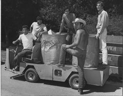 Student assistants on campus cart