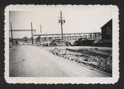 Two cars parked by the Jerome incarceration camp hospital