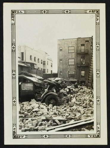 Santa Cruz Apartments, 700 Santa Cruz Avenue, parking lot with cars covered in debris, damage from the 1933 earthquake