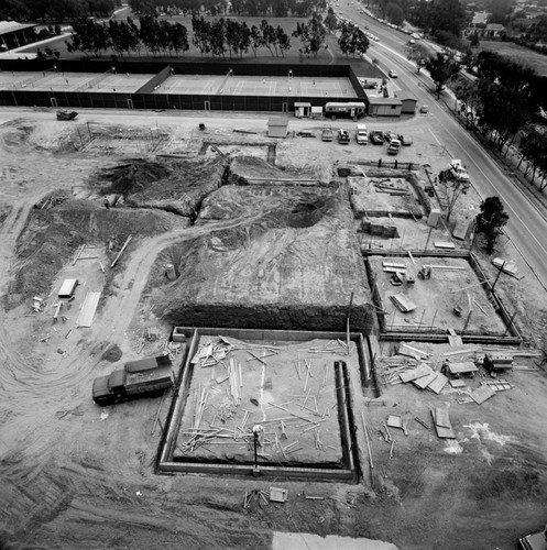 Photo depicts construction on the UCSD Muir College campus, also shown are the tennis courts in the background as well as La Jolla Shores Drive. July 27, 1970