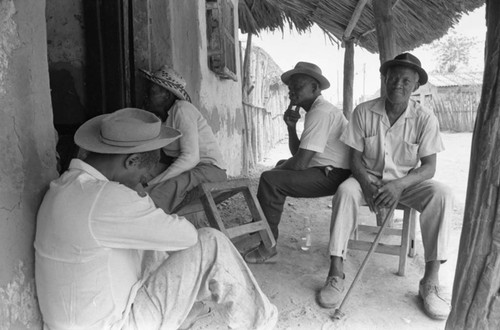 Men sitting outside, San Basilio de Palenque, Colombia, 1977