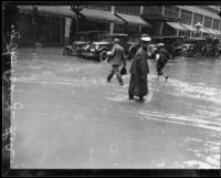 Flooded intersection of 8th and Broadway during torrential rainstorm, Los Angeles, 1926