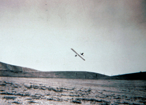Photograph of a glider at the edge of Alhambra airport