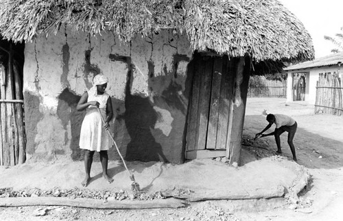 Woman sweeping in the street, San Basilio de Palenque, 1976