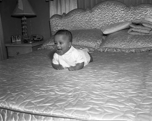 Infant on bed, Los Angeles