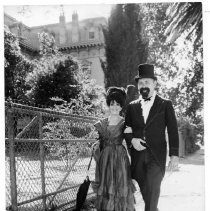 Couple dressed in early 1900's attire outside Stanford Home