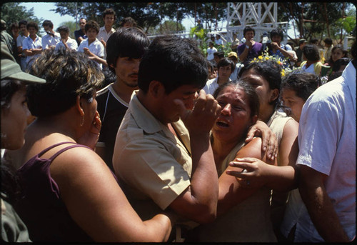 A man and a woman mourn, Nicaragua, 1983