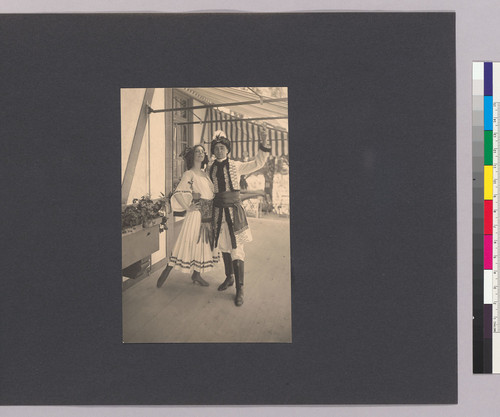 [Album page with snapshot of man and woman in costume at the Beresford Country Club.]