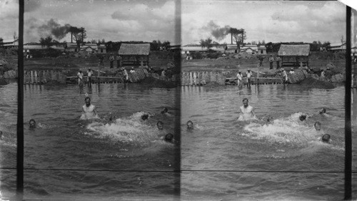 The Colorado volunteers taking a dip in the Rio Pasig, Manila, P.I