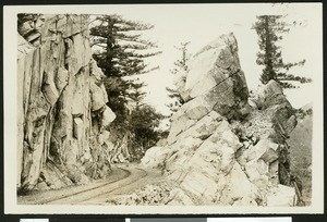 Unidentified rock formation, showing narrow railroad tracks to the left