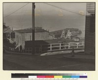 [Unidentified street, with pier in distance. San Francisco.] [photographic print]