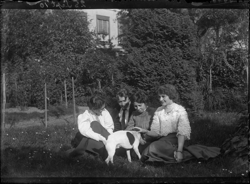 25 Sept '10. [Group with dog on grass. Johan Hagemeyer, second from left? 1910.] [negative]