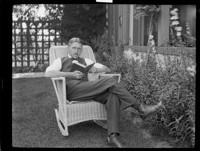 [Johan Hagemeyer reading in chair.] [negative]