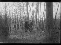 [Woman and man in forest. Johan Hagemeyer, left?] [negative]