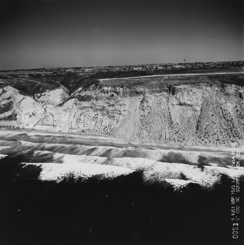 Aerial view of the cliffs and the canyon just north of Scripps Institution of Oceanography. September 1954