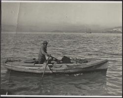 Fisherman in a rowboat, San Francisco Bay, California, 1920s