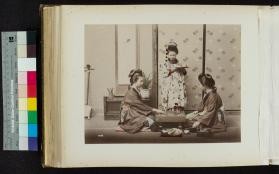 Photograph of women playing board game