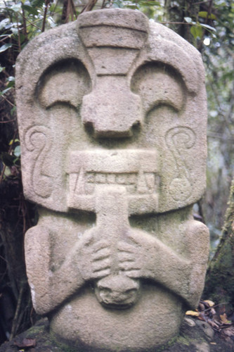 Stone statue, figure holding a child, San Agustín, Colombia, 1975