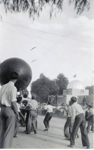 Boys playing with giant medicine ball at the Colorado River Aqueduct celebration in downtown Banning, California