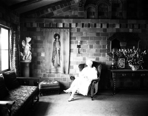 Carrie Jacobs Bond seated in room, Mission Inn