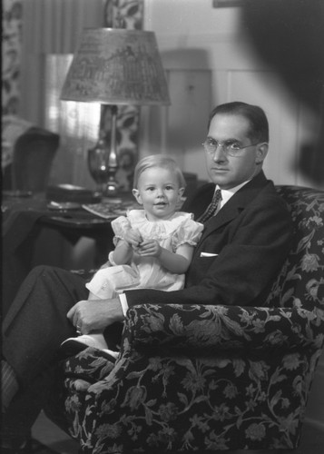 L. B. Strater holding baby