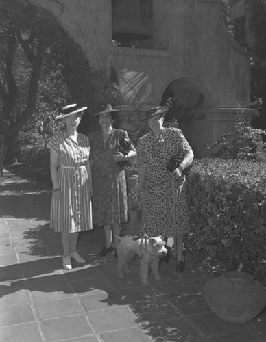 Three women with dog, Mission Inn