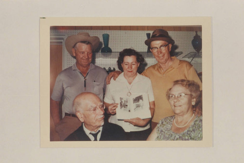 Dock Marston and Pearl Baker with members of the Busenbark family. Green River, Utah. At the first sale of Pearl's book, "Trail on the Water."