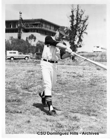 Toro baseball player swinging bat