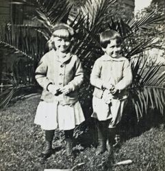 Wilfred Everett Bixby, Jr. and an unidentified girl at the Bixby house, 415 Perkins Street, Oakland, California, about 1911