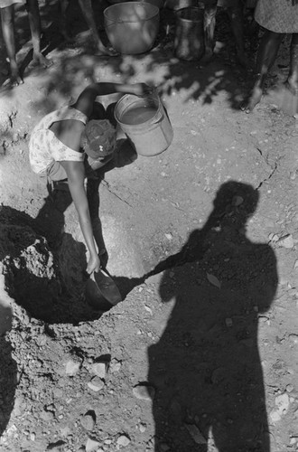 Girl collecting water at river, San Basilio de Palenque, ca. 1978