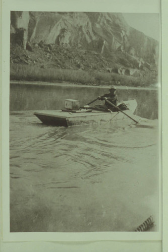 "In Glenn Canyon." Charles Russell is in the boat. The original print shows the boat going the other way. This copy seems to have been reversed. Tadje has a slide made from this photo