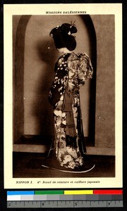 Woman models kimono and hairstyle, Japan, ca.1920-1940