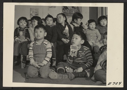A nursery school group at the Heart Mountain Relocation Center where persons of Japanese parentage, evacuated from west coast defense areas, are now residing. Photographer: Parker, Tom Heart Mountain, Wyoming