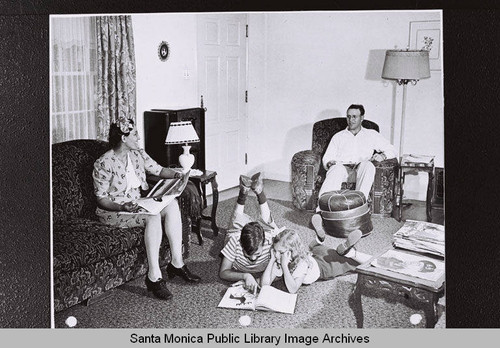 Family relaxes in their living room, Douglas Aircraft Company employee housing during World War II