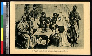 Sister helping patients at a dispensary, India, ca.1920-1940
