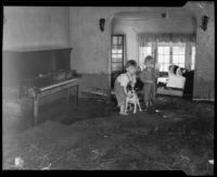 Two boys and a dog inside their flood-damaged house, La Crescenta-Montrose, 1934