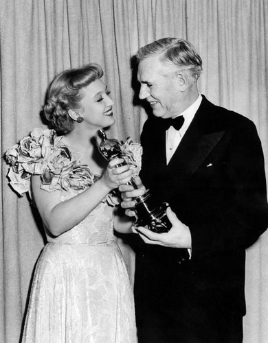 Celeste Holme and Walter Huston