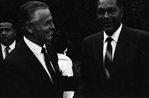 Congressman Alphonzo Bell, Jr. talking with Tom Bradley, Los Angeles, 1969