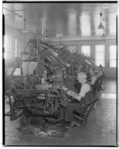 Men typing on Line-o-type machines at the Long Beach Telegram
