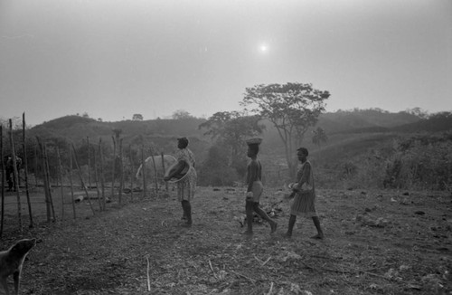Villagers walking on farmland, San Basilio de Palenque, 1977