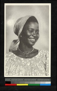 Smiling young woman standing for a portrait, Congo, ca.1920-1940