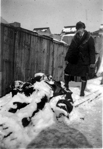 Mark Moody standing over a fallen sniper's body following Rudolf Gajda's revolt in Vladivostok