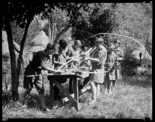 Making bows and arrows at Santa Monica Girl Scout camp