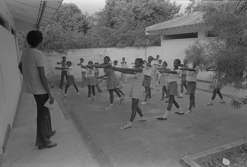 Teenagers and children at school during physical education, San Basilio de Palenque, 1976