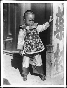 Small Chinese boy in traditional clothing, ca.1900-1920