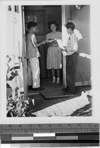 Young men delivering newspapers at Granada Japanese Relocation Camp, Amache, Colorado, ca. 1942